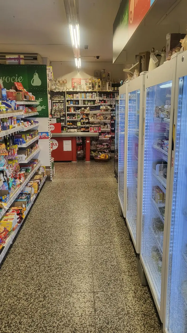 A view across the shop towards the till – chilled drinks and food