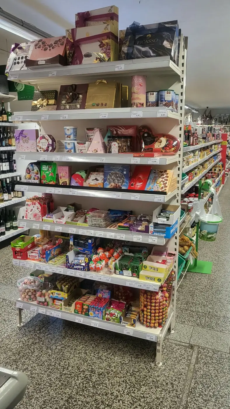 A display of sweets, boxes of chocolates, chocolates and wine