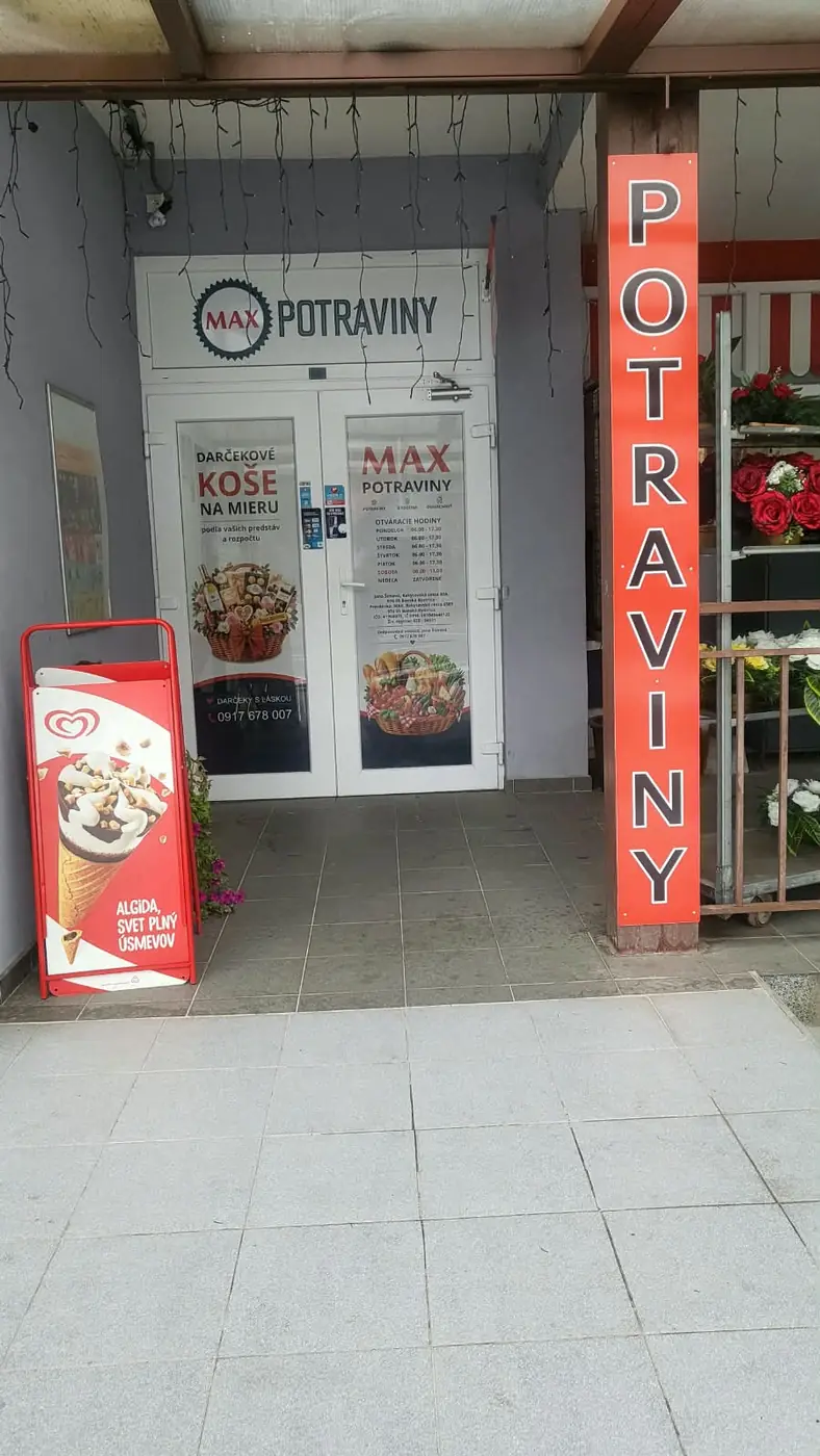 The entrance to the MAX Potraviny shop in Rakytovce, showing its opening hours and range of bespoke gift hampers